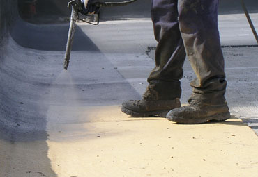 Coating systems over Fresno spray foam roof systems